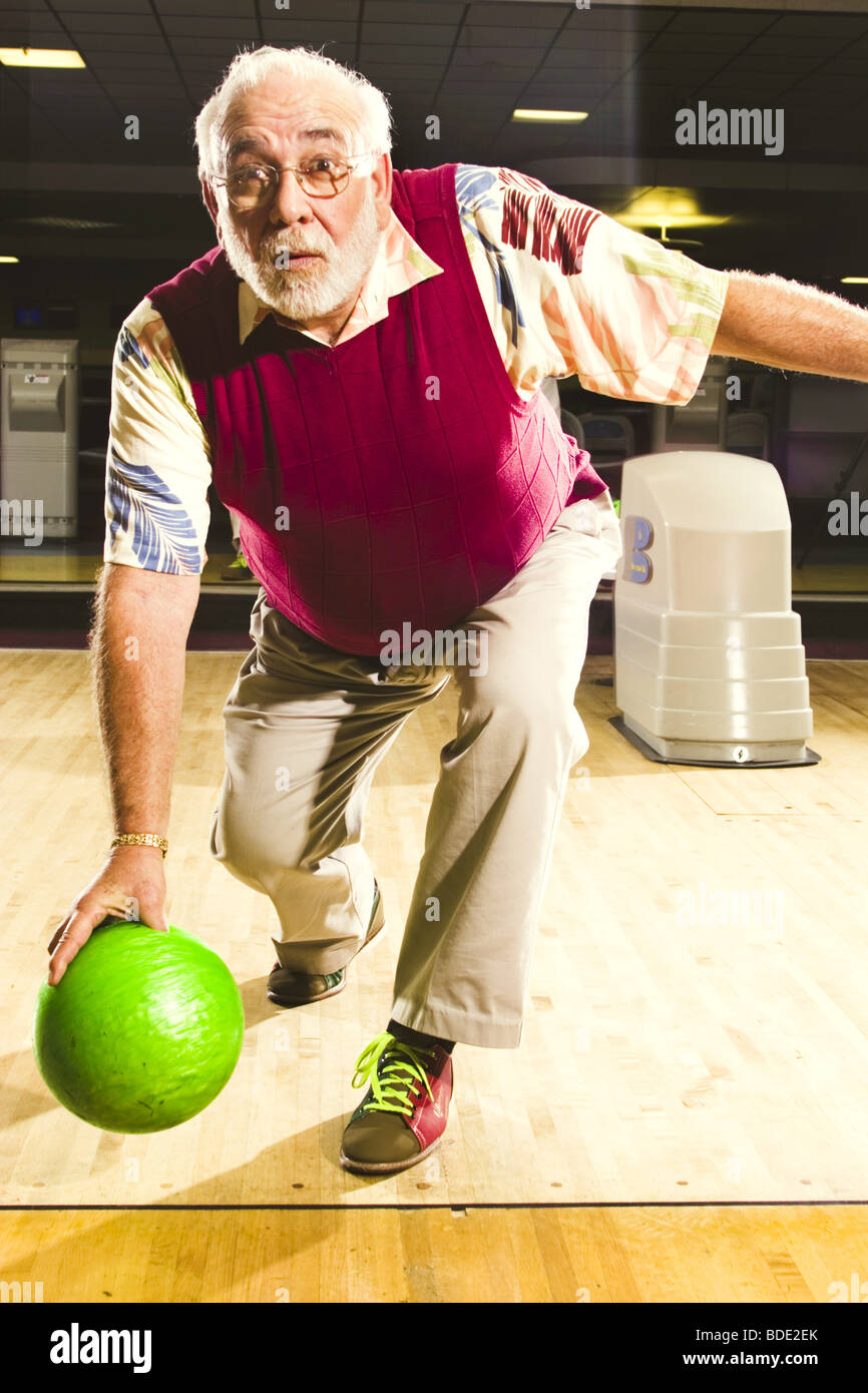 Portraits of a senior man bowling Stock Photo