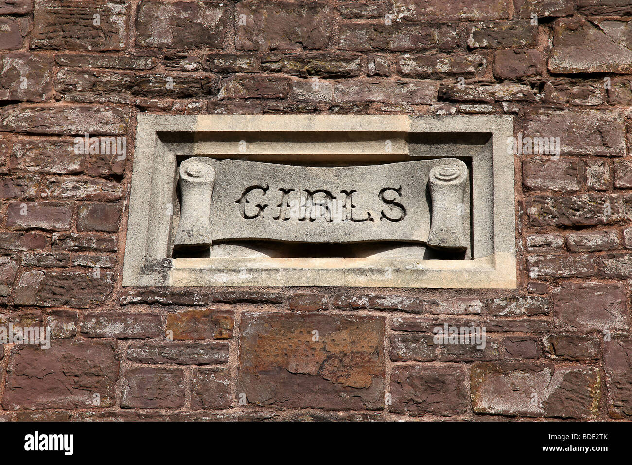Pic by Mark Passmore. 20/08/2009. Detail of a Sign for Girls surrounded by a stone wall, pictured at The Tiverton Museum. Stock Photo