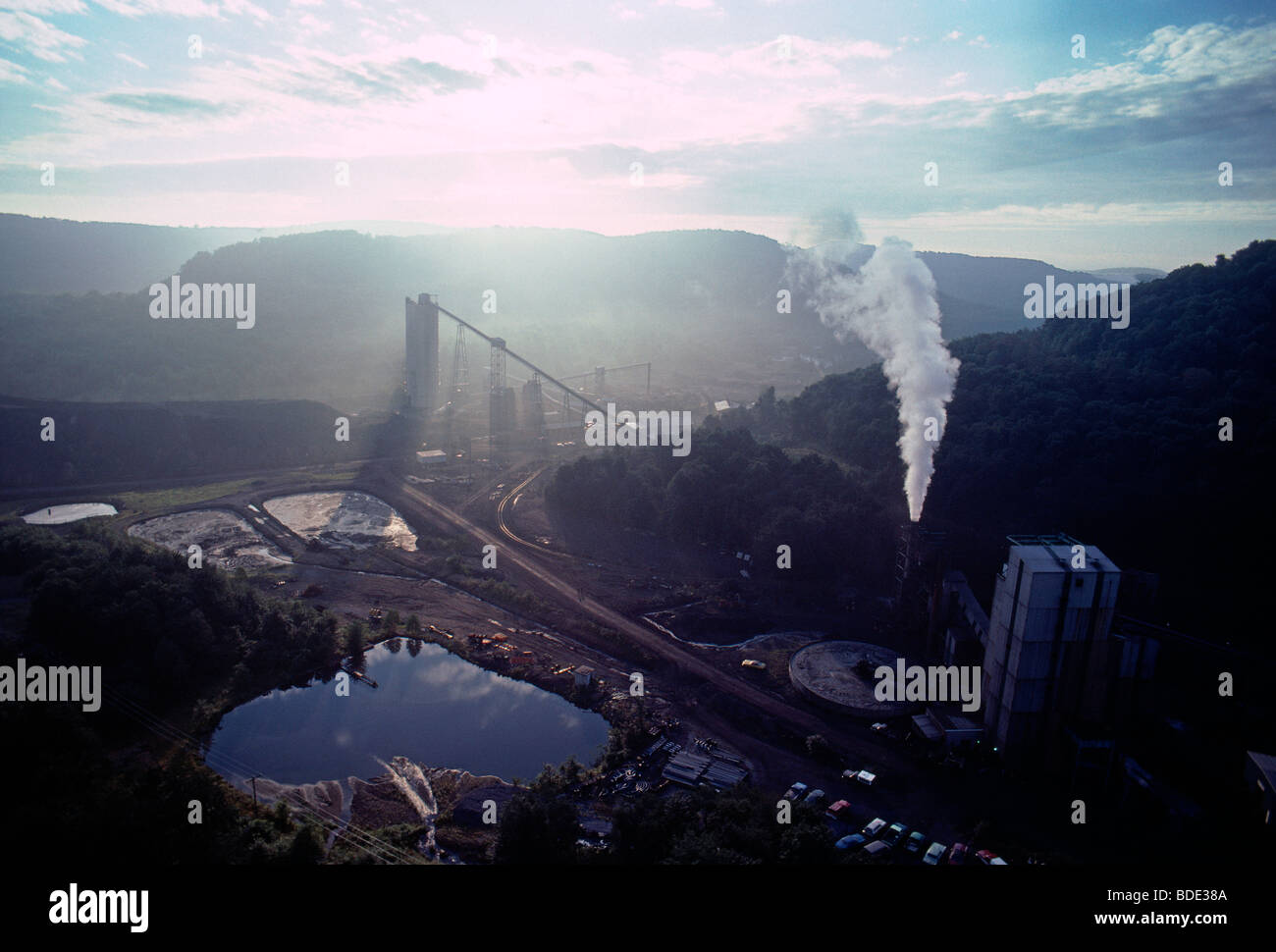 Aerial view of backlit coal processing plant at sunrise in western