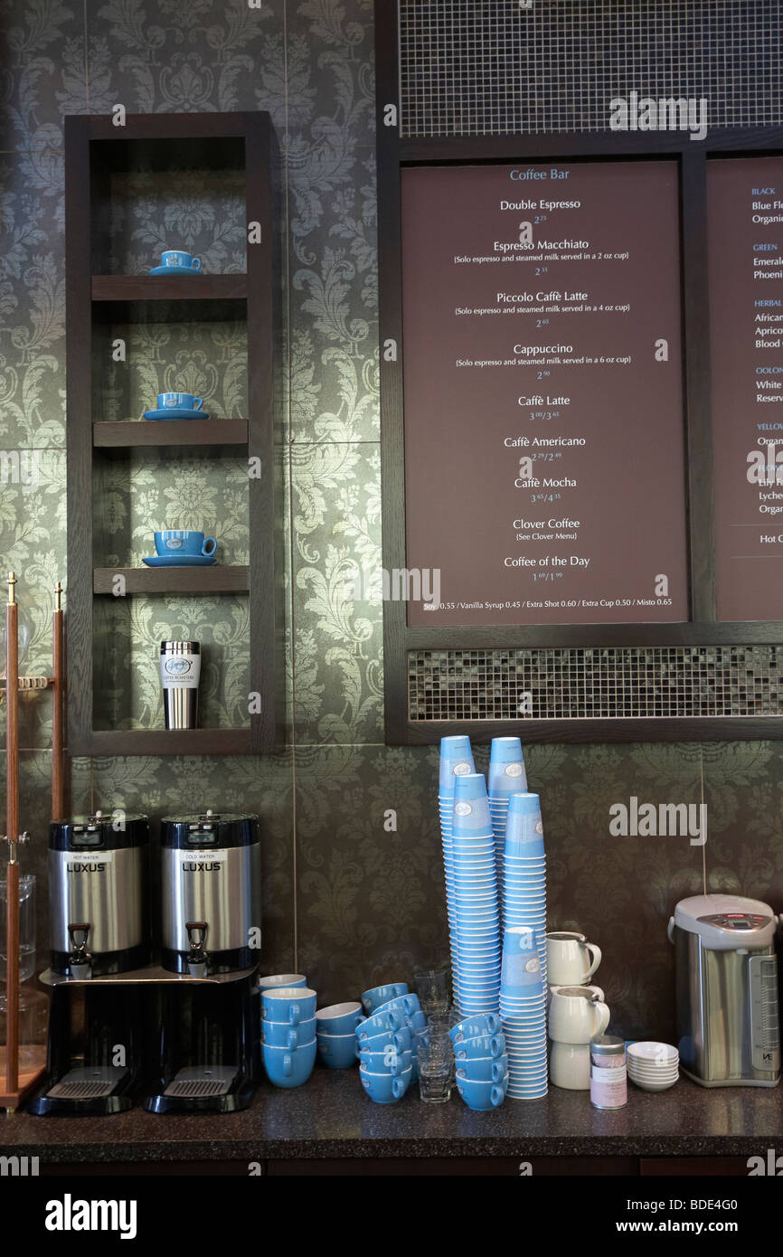 Menu board and counter with coffee cups and coffee pots, Vancouver, BC