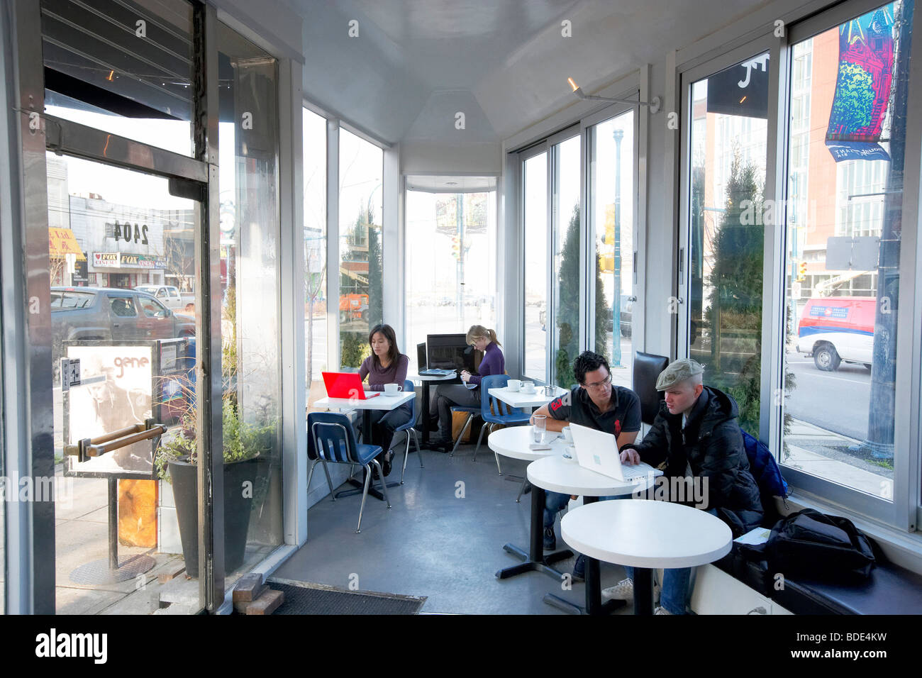 Patrons customers in narrow diner coffee shop, Vancouver, BC, British