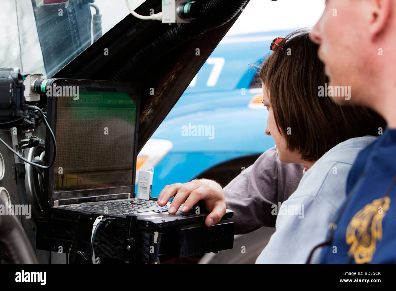 Researchers check a laptop for information during Project Vortex 2 in Kimball, Nebraska, USA, June 5, 2009. Stock Photo