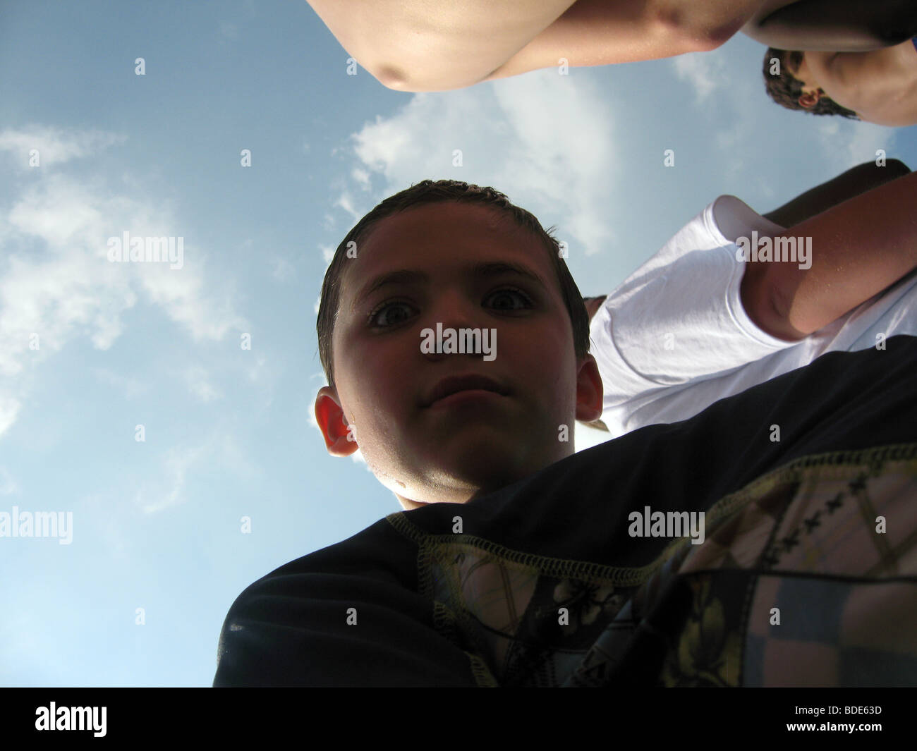 Boy looking down Stock Photo