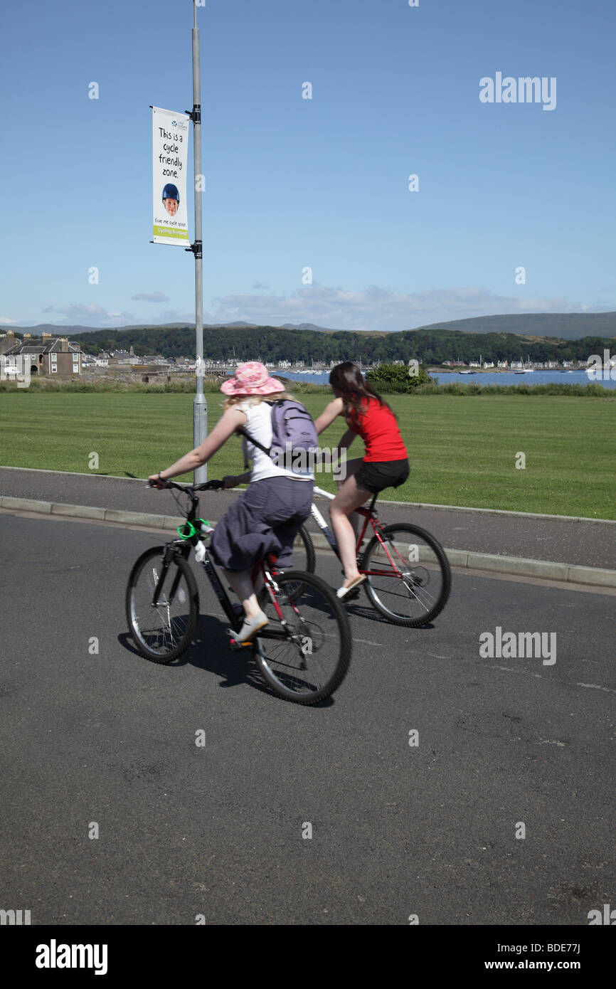 Cyclist in the town of Millport on the Island of Great Cumbrae, West Coast of Scotland, UK Stock Photo