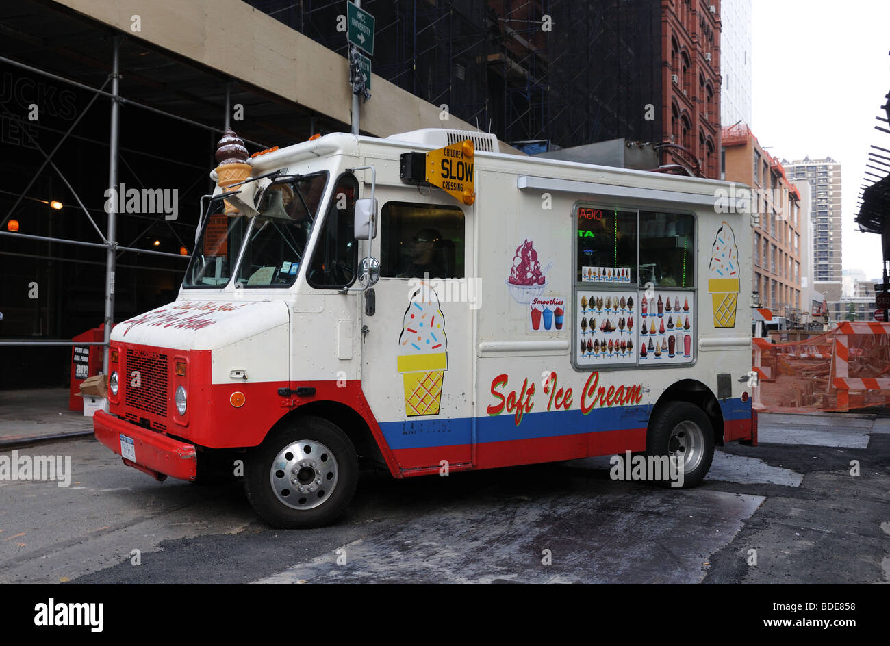 Summer brings ice cream trucks to New York City. This one is parked on a street under construction in Lower Manhattan. Stock Photo