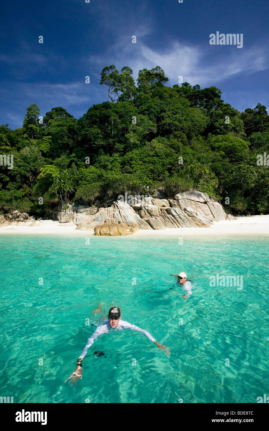 Tourists have found a paradise beach in Pulau Perhentian, Malaysia. Stock Photo