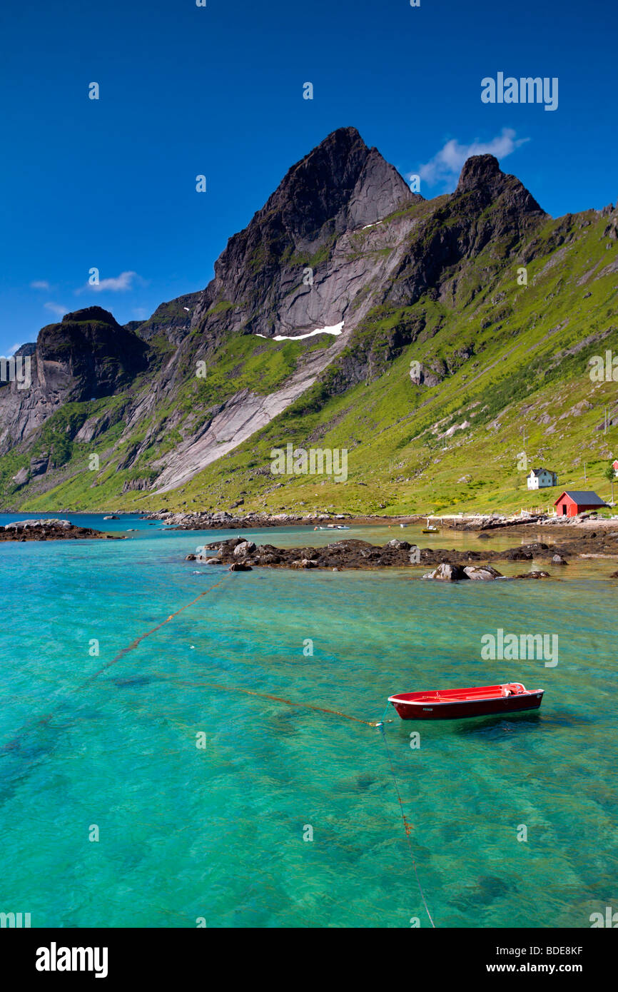 Vindstad Bunes Hike: Red Boat with Mountains Stock Photo