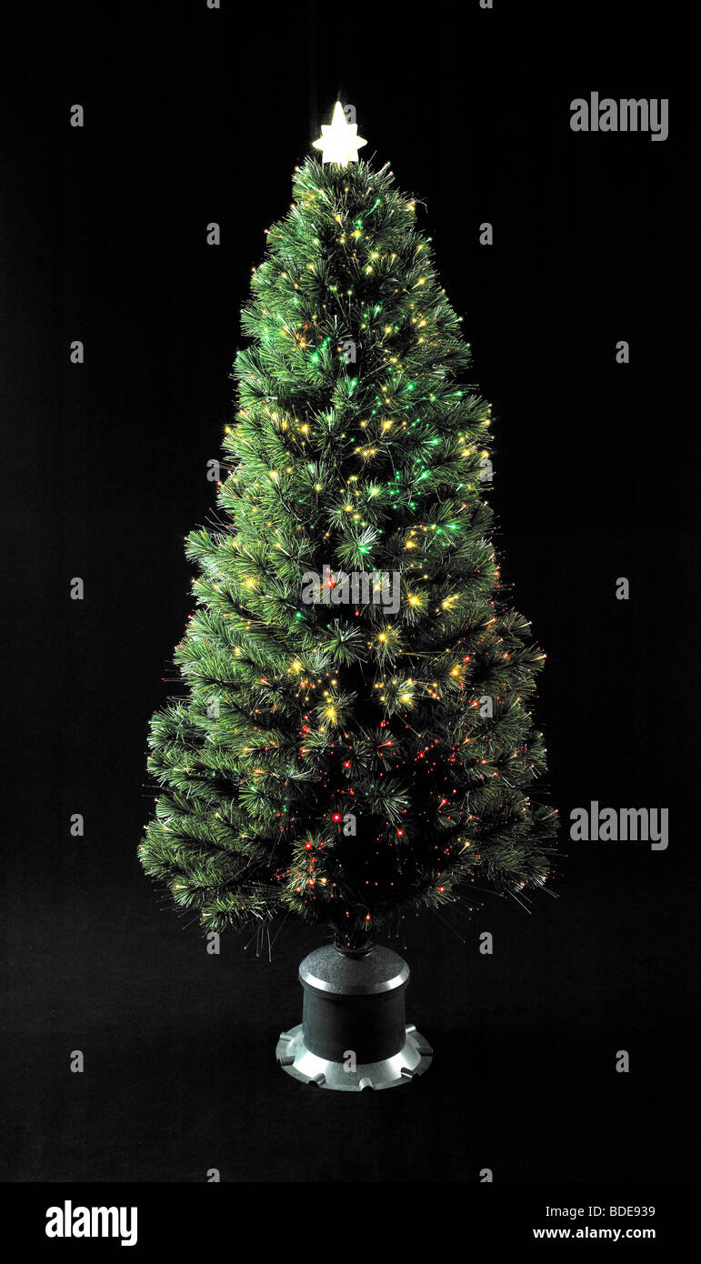 Xmas Tree with lights sitting on black background Stock Photo - Alamy