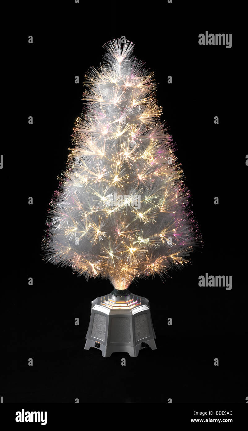 Xmas Tree with lights sitting on black background Stock Photo - Alamy