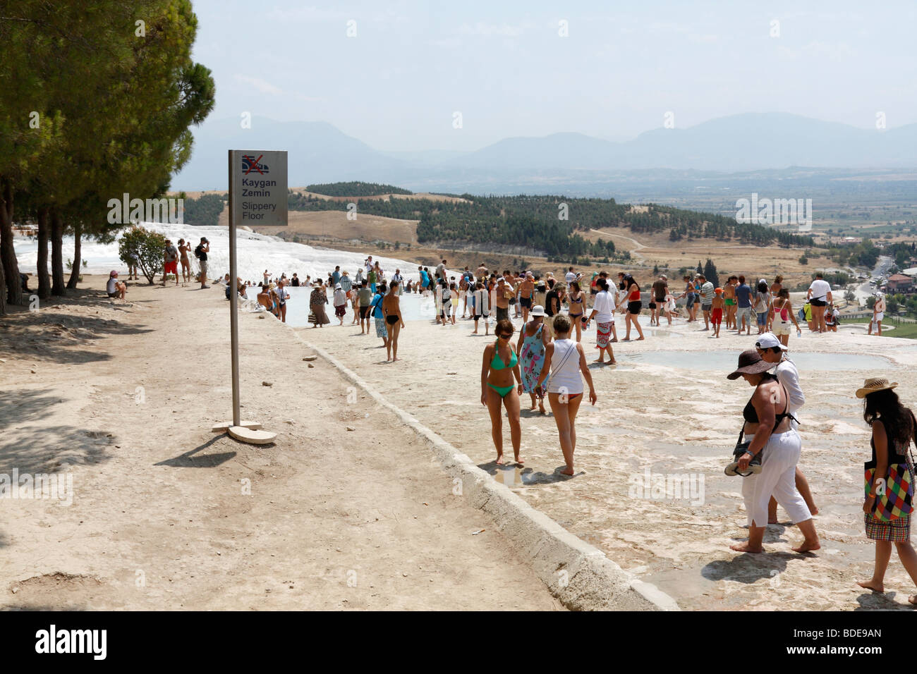 People is walking on the limestone travertines of Pamukkale (Hierapolis), Denizli, Turkey, August, 2009 Stock Photo