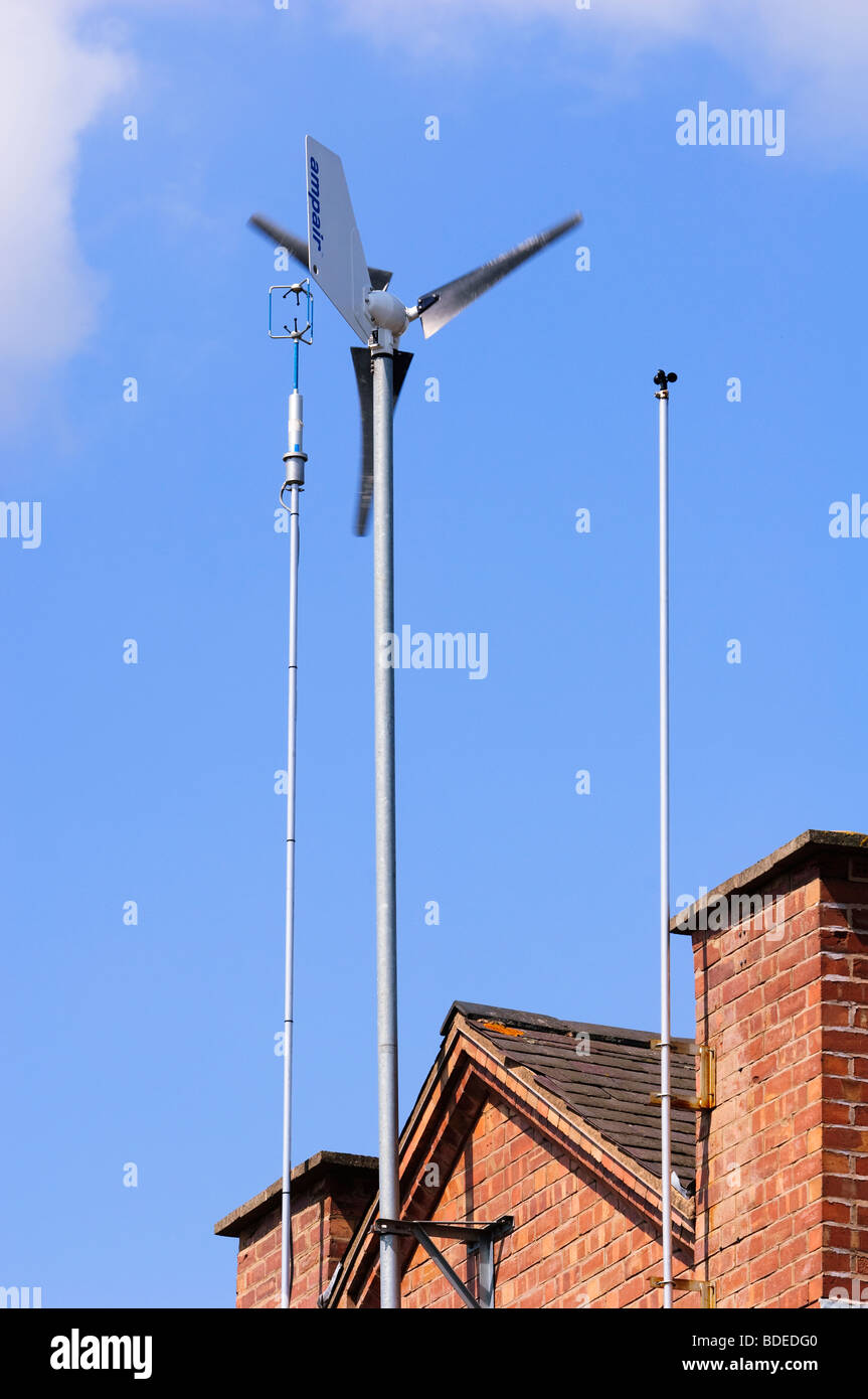 Wind generator and anemometer affixed to the Southerly wall of a residential house in Leamington Spa, Warwickshire, UK. Stock Photo