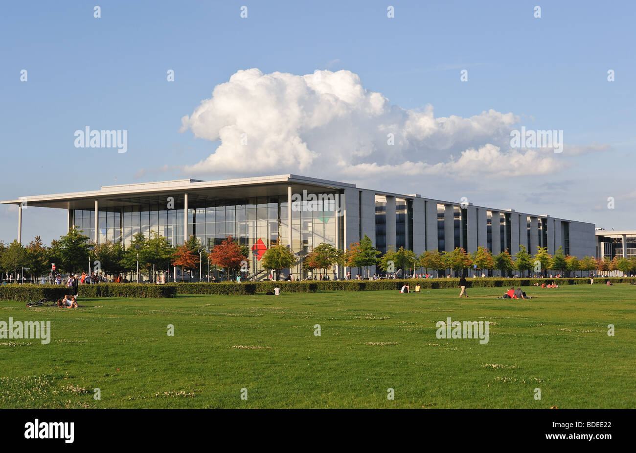 Paul Loebe Haus, the office building for the German parliamentarians with a big cloud in the background. Soft evening light. Stock Photo