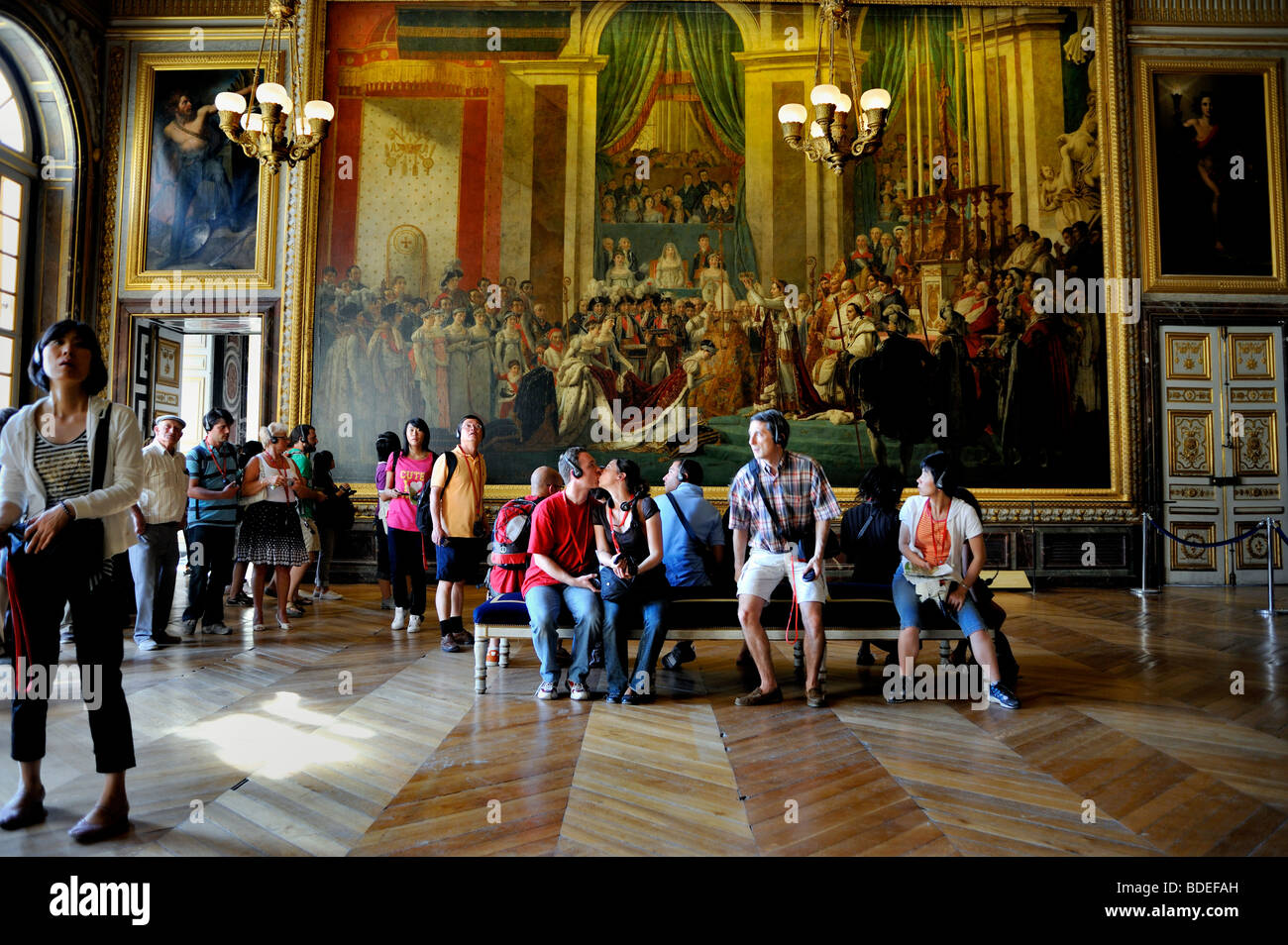 Versailles Palace - Tourists Visiting French Monument, 'Chateau de Versailles', inside Royal Apartments, Young COuple Kissing, Palace of Versailles Stock Photo