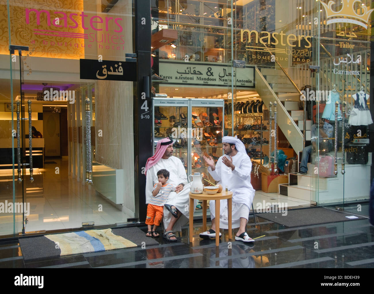 Middle Eastern men conversing in the Little Arabia district of Bangkok Thailand Stock Photo