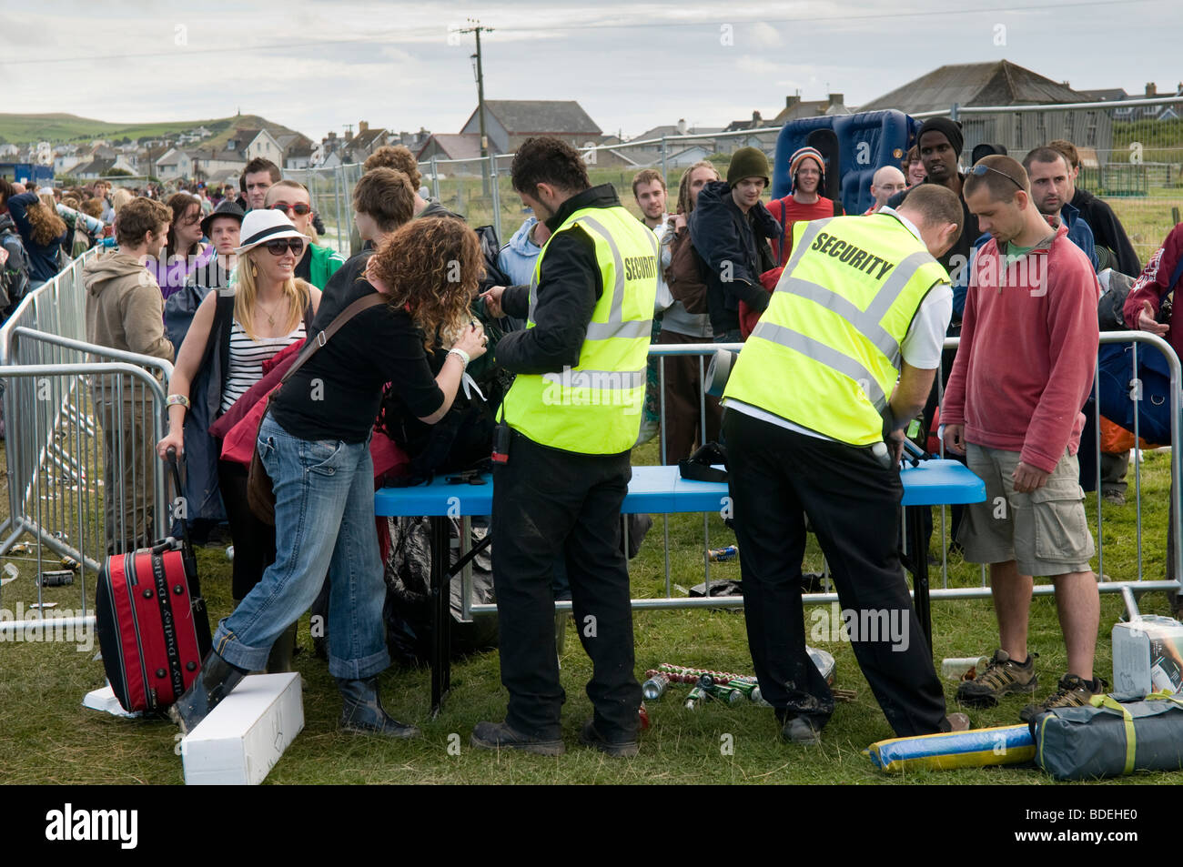 Security workers searching people arriving at The Square Festival ...