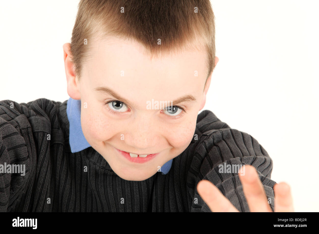 Portrait of young happy boy against white background Stock Photo - Alamy