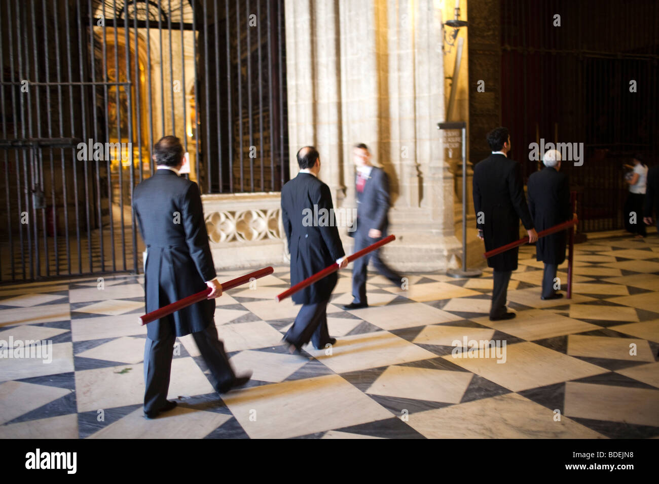 Brotherhood members bearing candles at the end of Corpus Christi