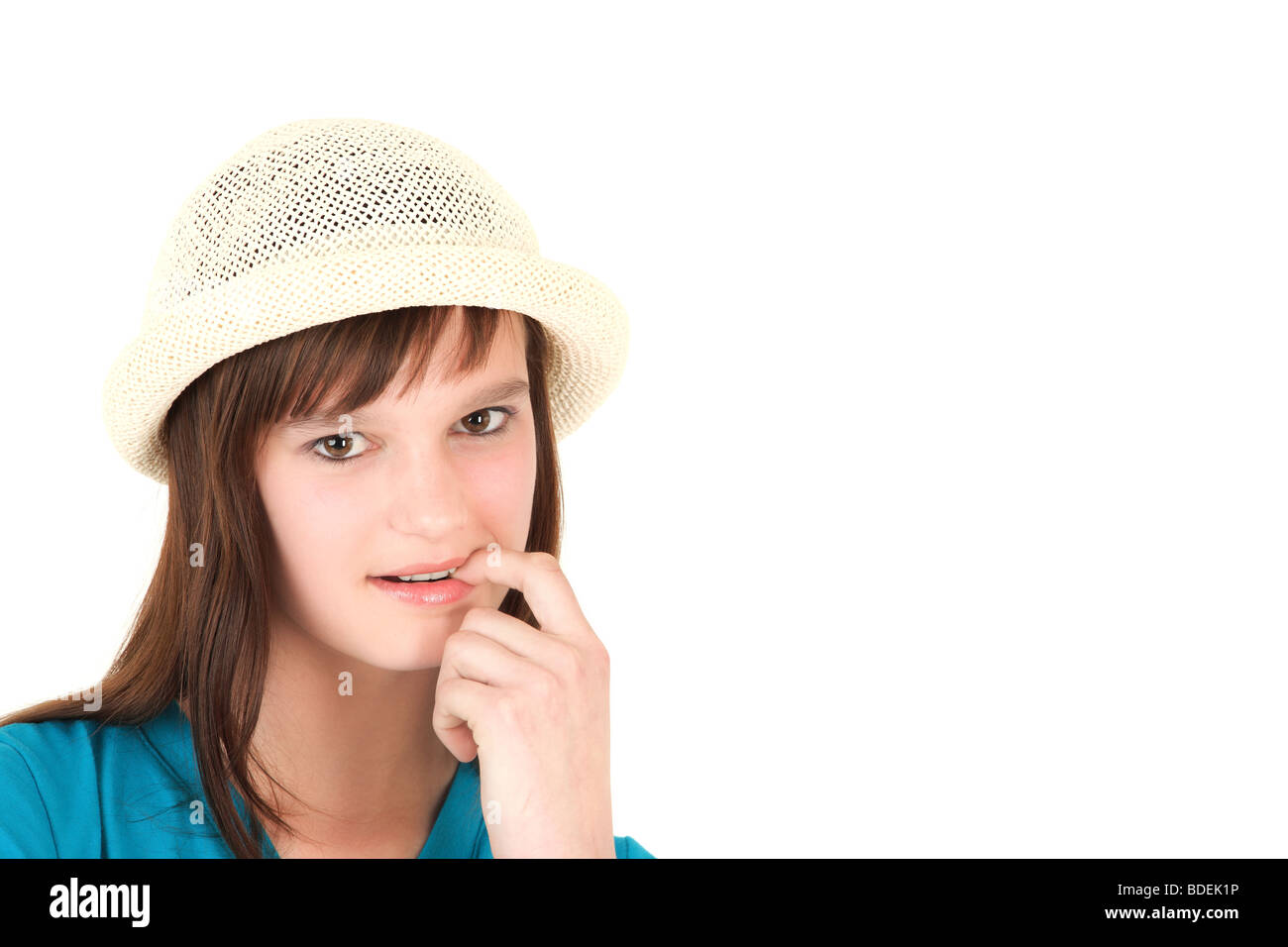 Portrait of teenage girl wearing hat against white background Stock Photo Alamy