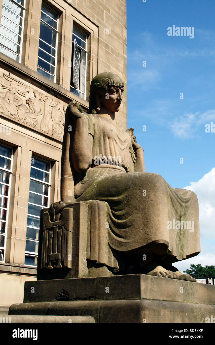 Statues outside Huddersfield Public Library depicting Arts and