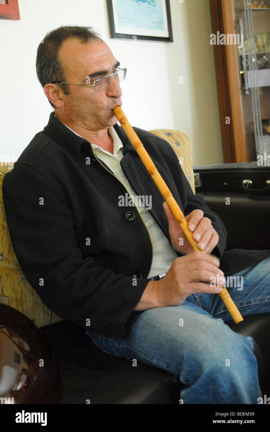 Israel, Carmel Mountain, Daliyat al-Karmel a Druze town in the North District, man plays a cane flute Stock Photo