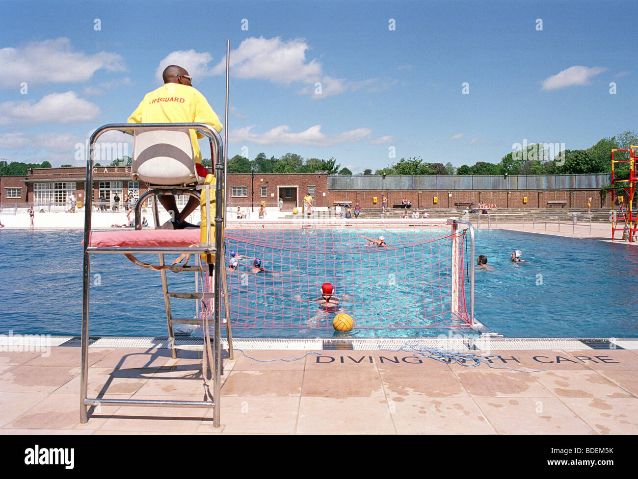 Open Air Lido In Hampstead A Lifeguard On Duty On A Sunny Hot Day