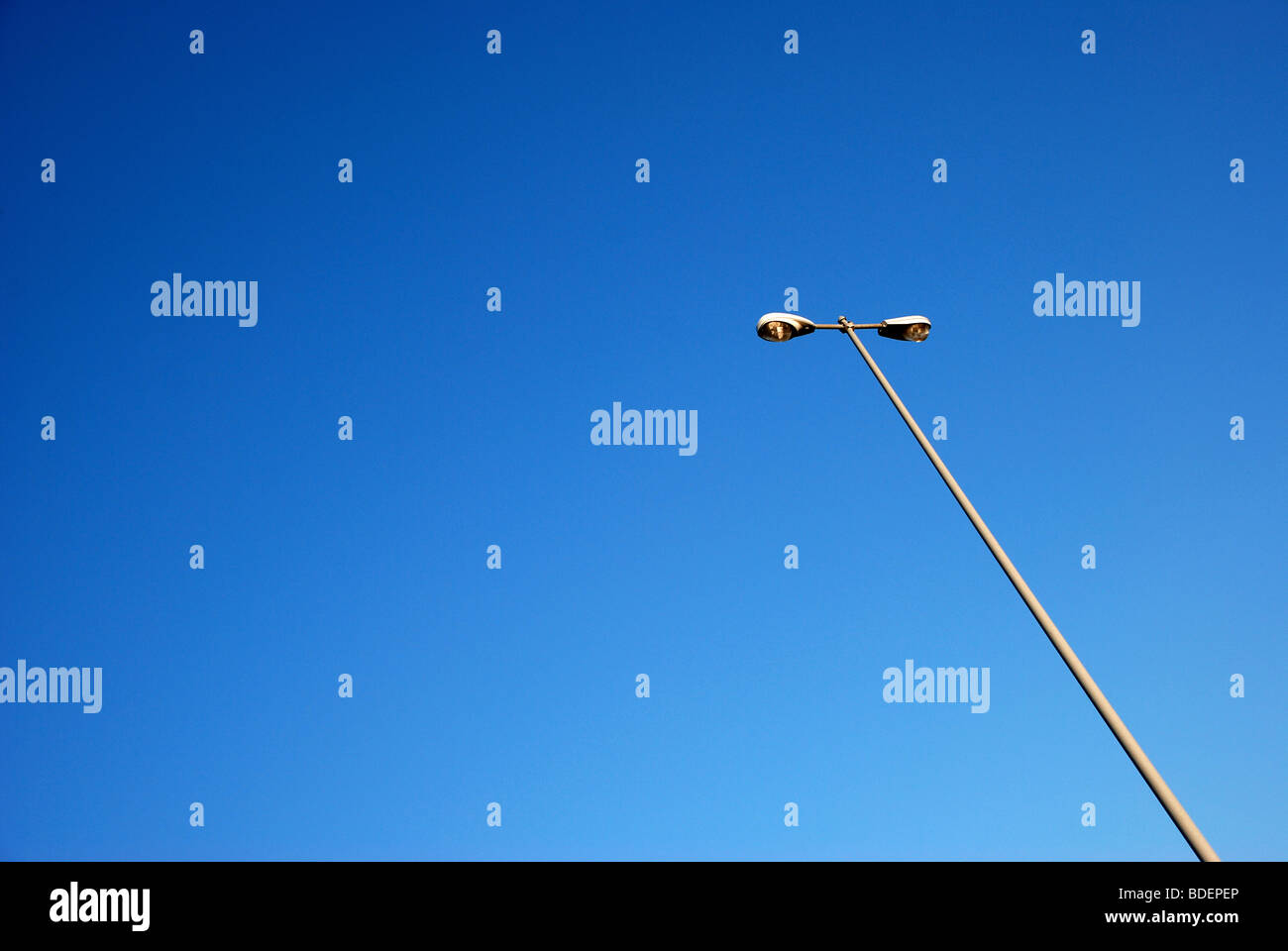 Rest are lamp posts against blue sky Stock Photo Alamy