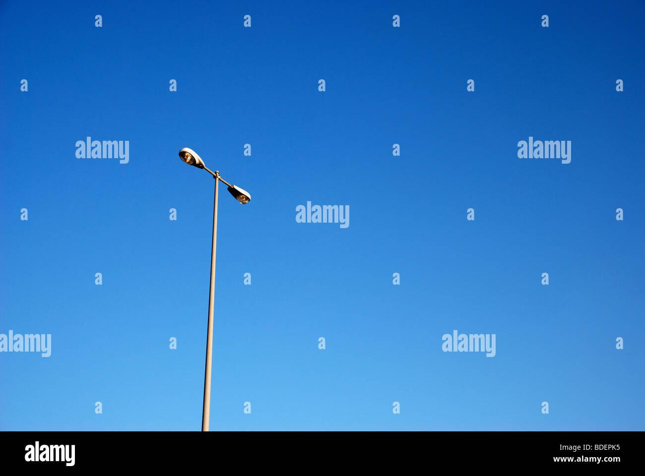 Rest are lamp posts against blue sky Stock Photo