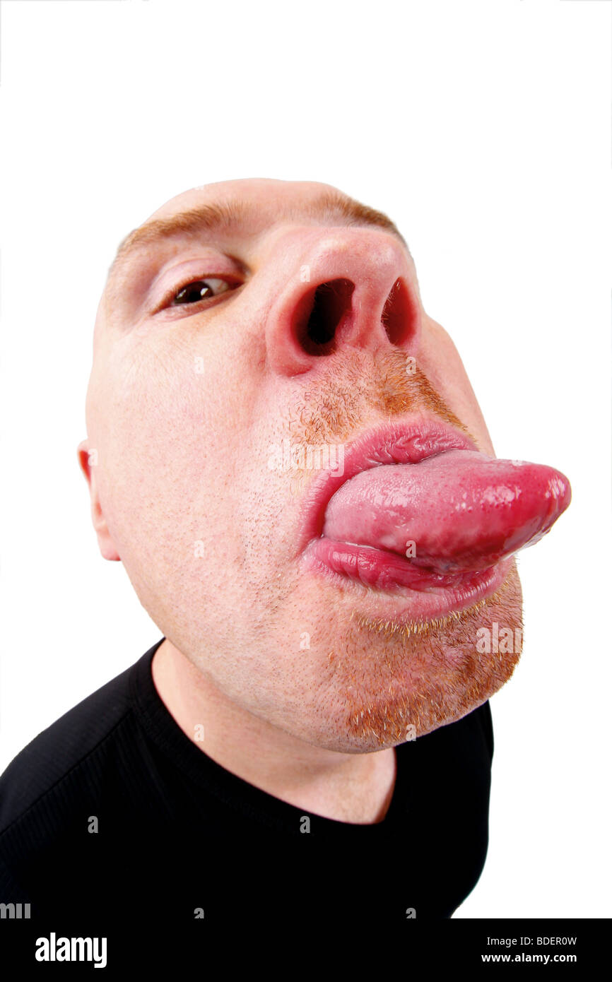 bald headed man poking tongue out Stock Photo