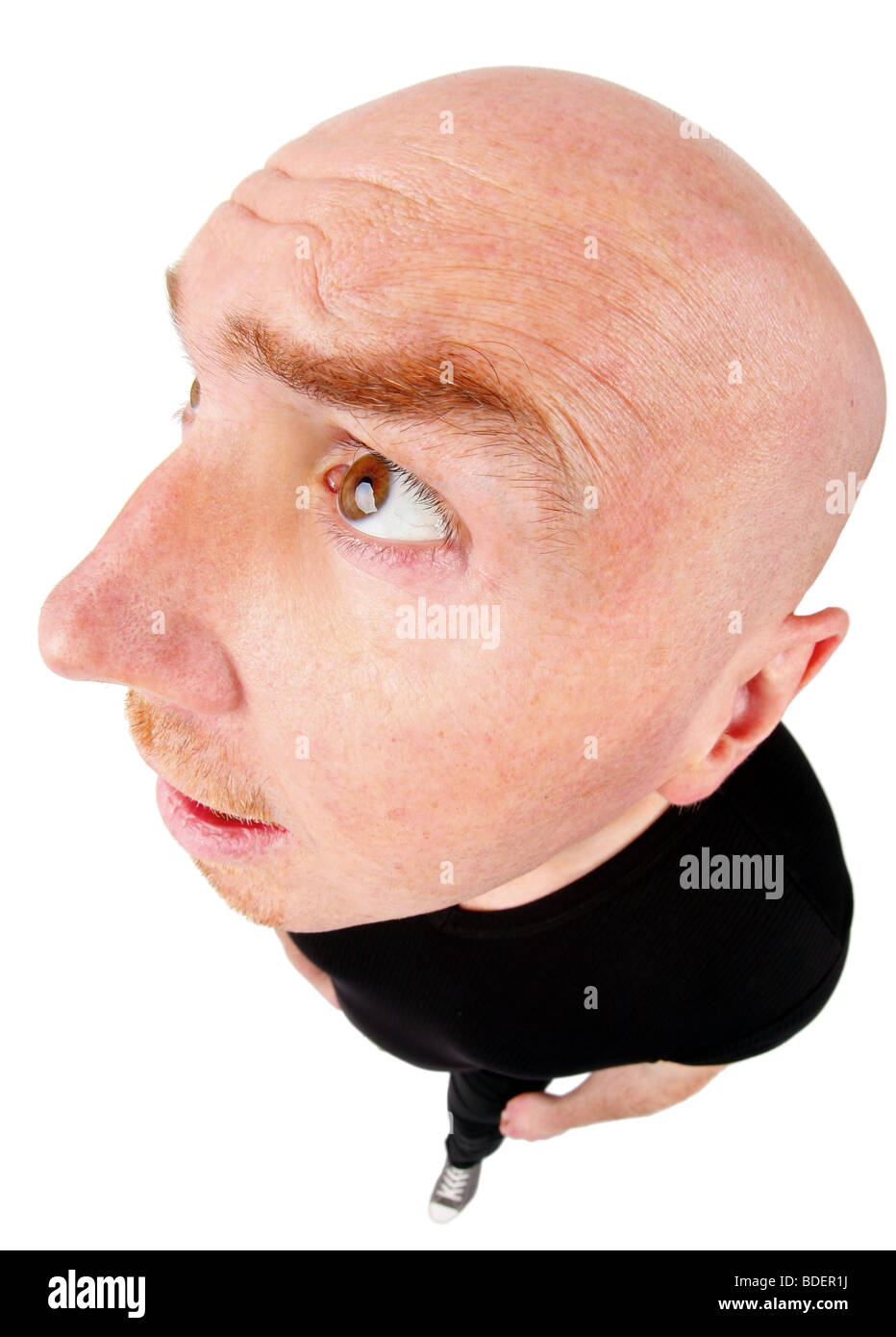 bald headed man looking up puzzled Stock Photo