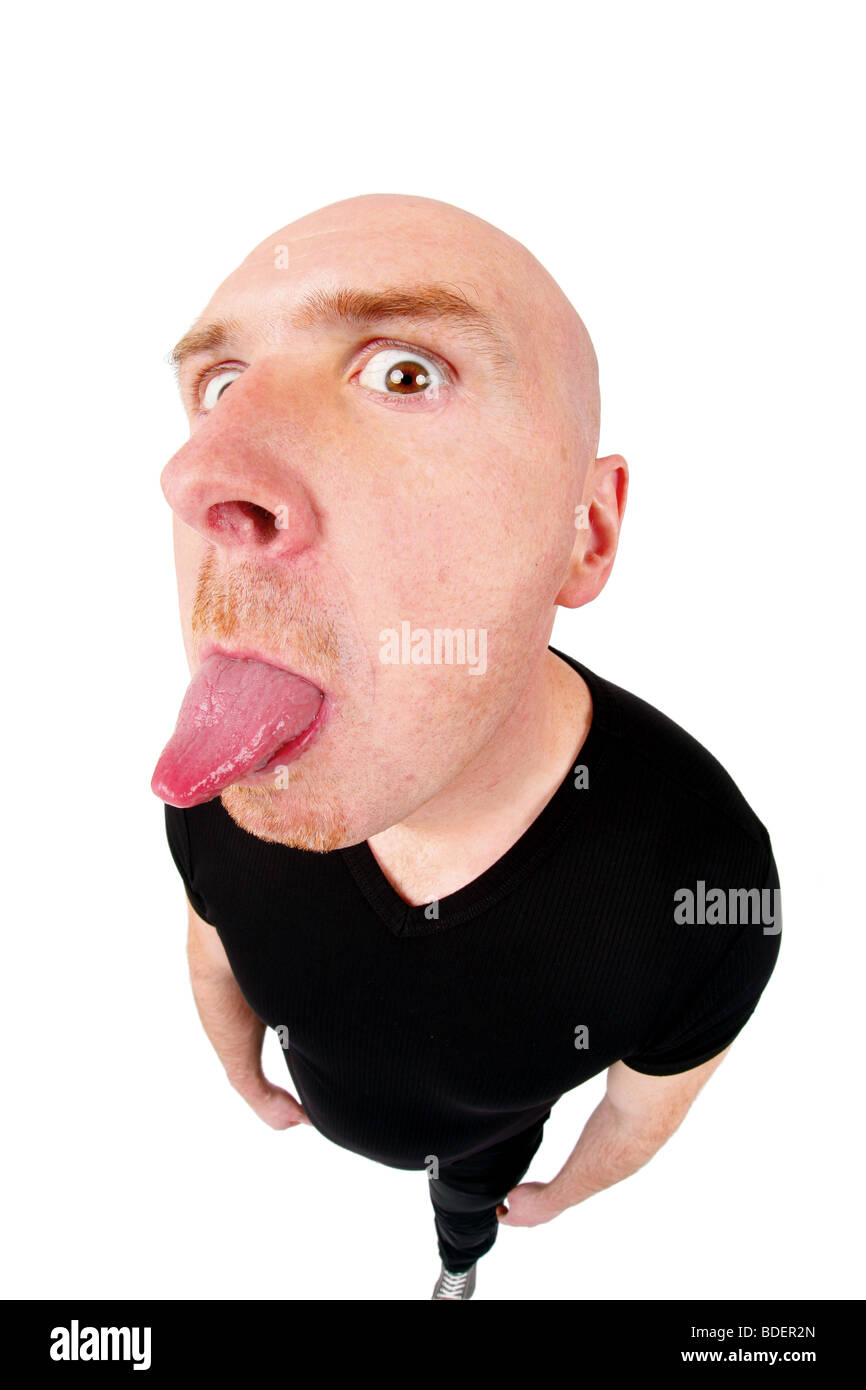 bald headed man poking tongue out Stock Photo
