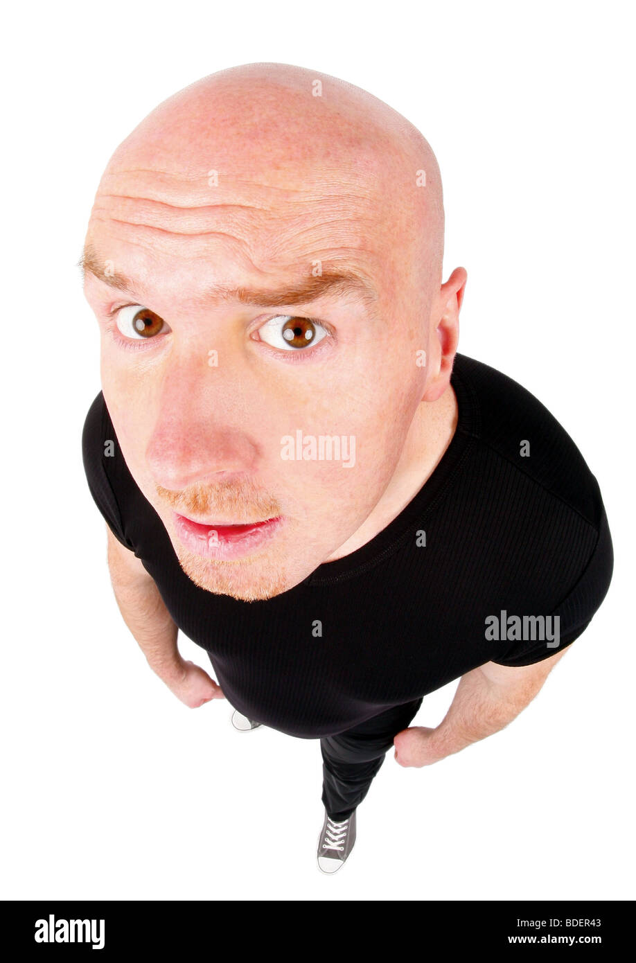 bald headed man looking puzzled into the camera Stock Photo