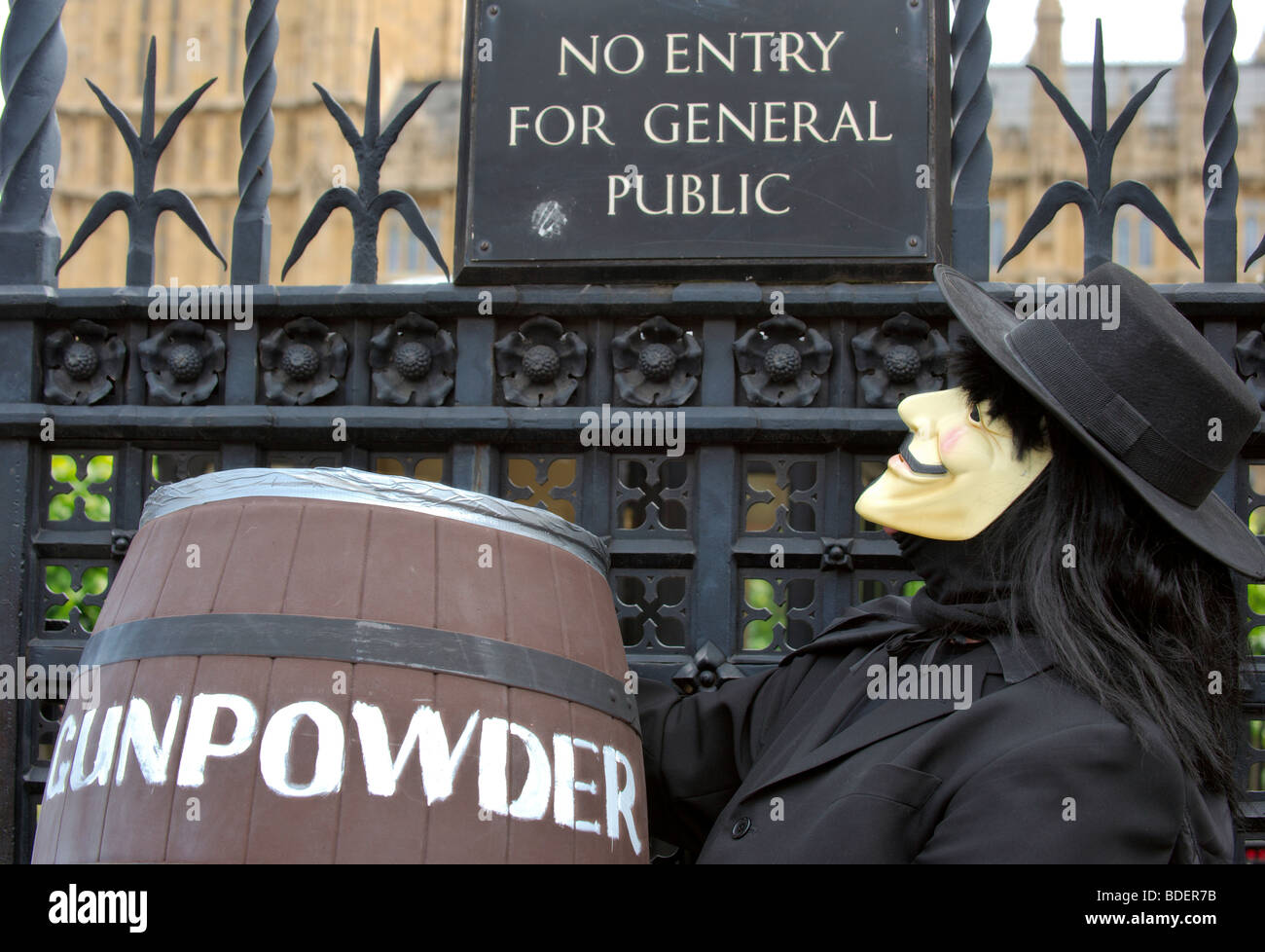Demonstrator dressed as Guy Fawkes outside Parliament protesting against MPs and their expenses Stock Photo