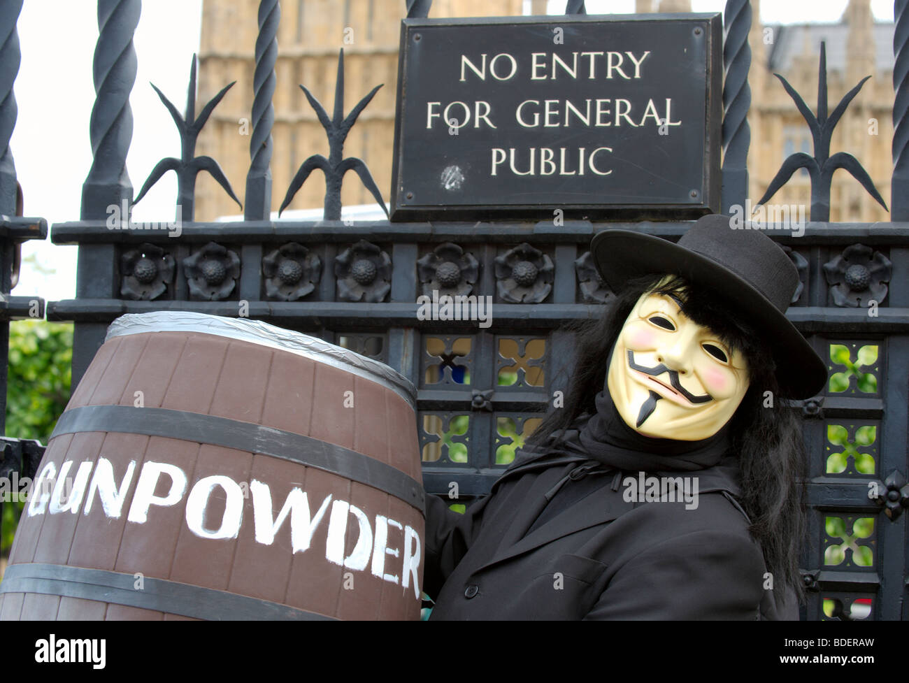 Demonstrator dressed as Guy Fawkes outside Parliament protesting against MPs and their expenses Stock Photo