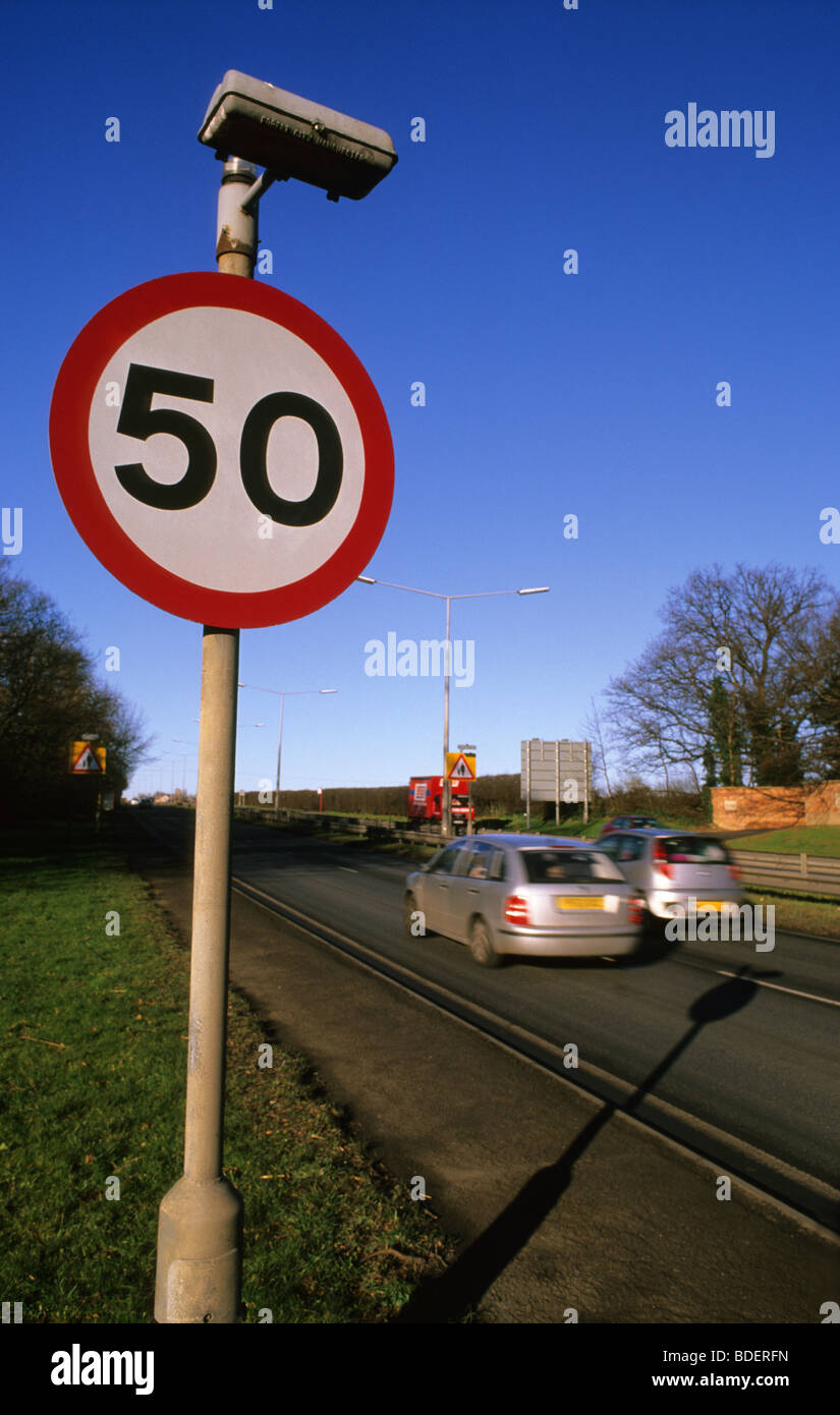 cars passing fifty miles per hour speed limit warning sign on road ahead near Leeds Yorkshire UK Stock Photo