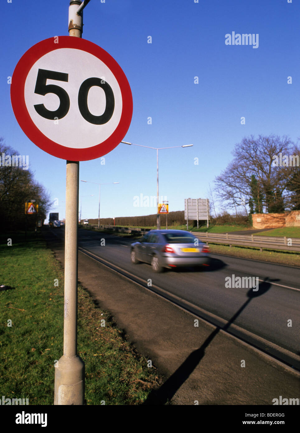 car passing fifty miles per hour speed limit warning sign for road ahead near Leeds Yorkshire UK Stock Photo