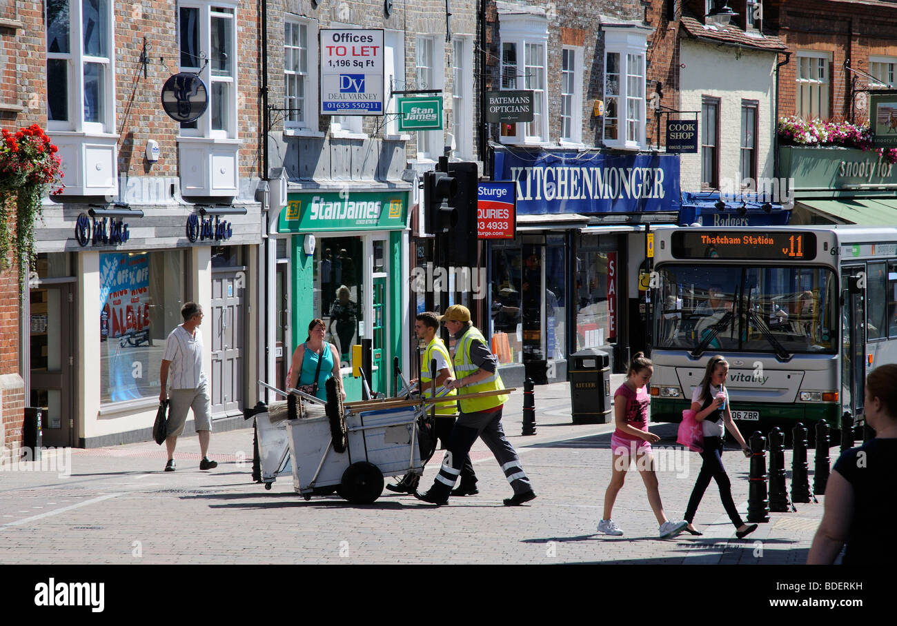 Newbury town centre activity road sweepers pedestrians shops Berkshire England UK Stock Photo
