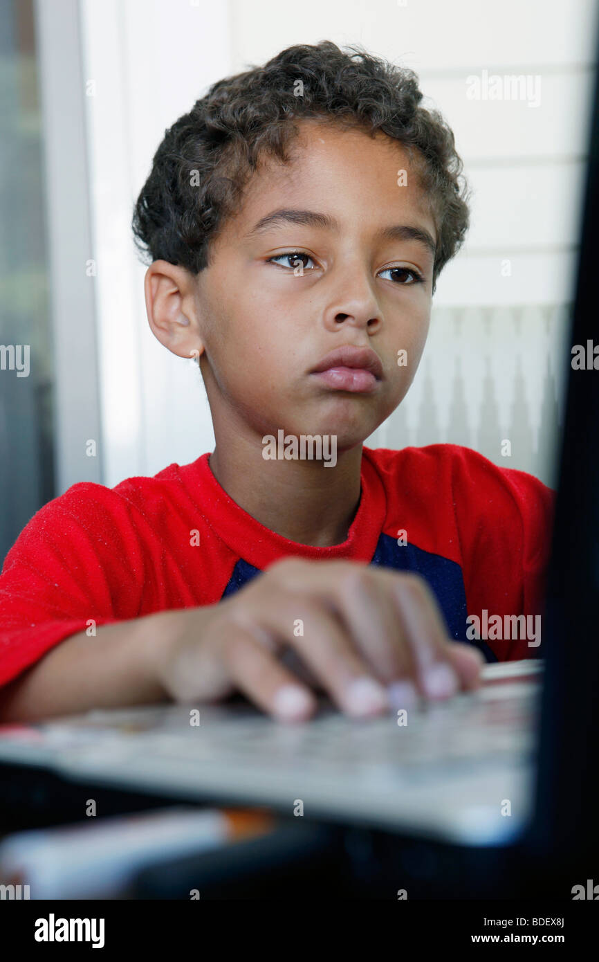 Boy, eight years old, laptop computer Stock Photo