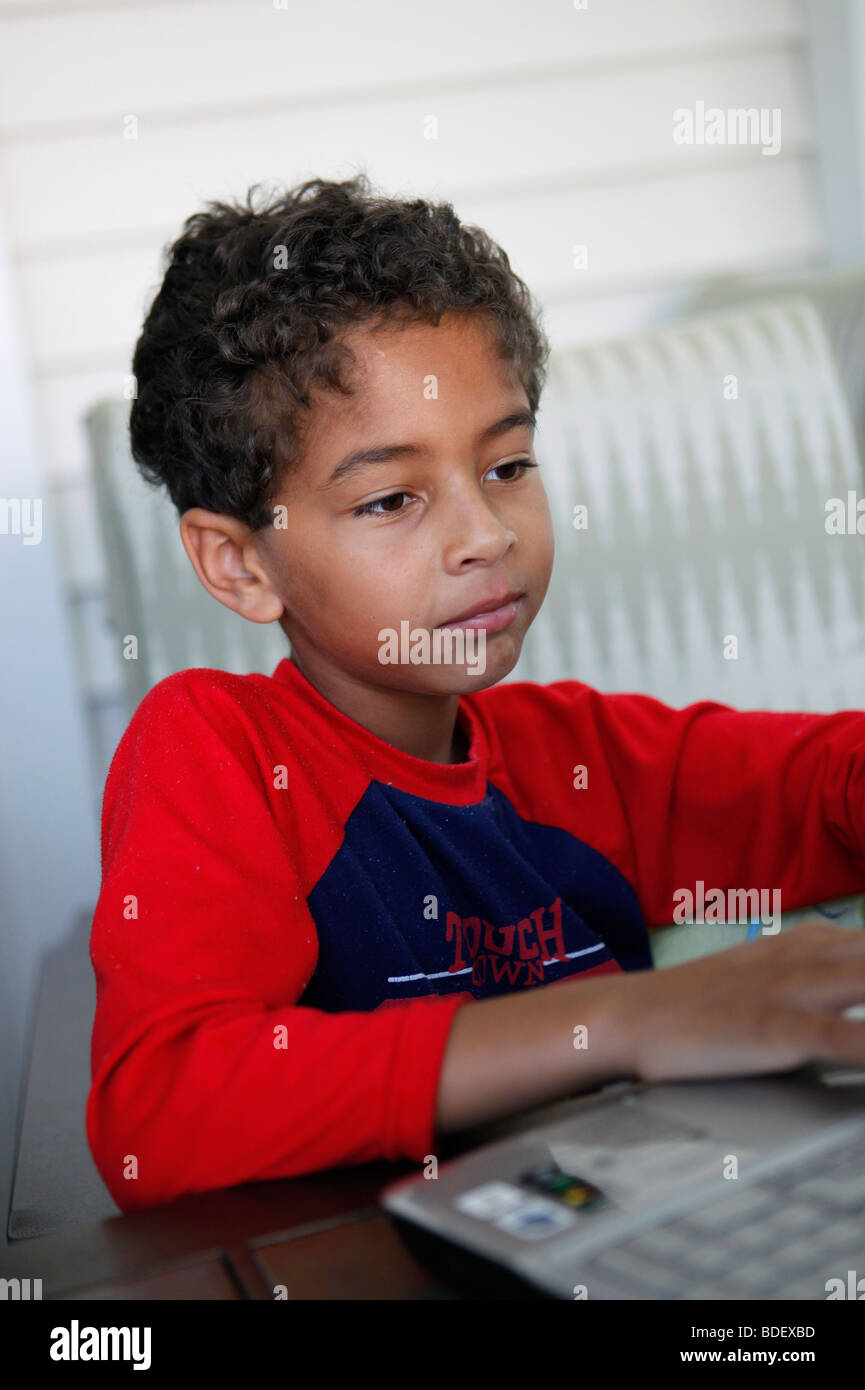 Boy, eight years old, laptop computer Stock Photo - Alamy
