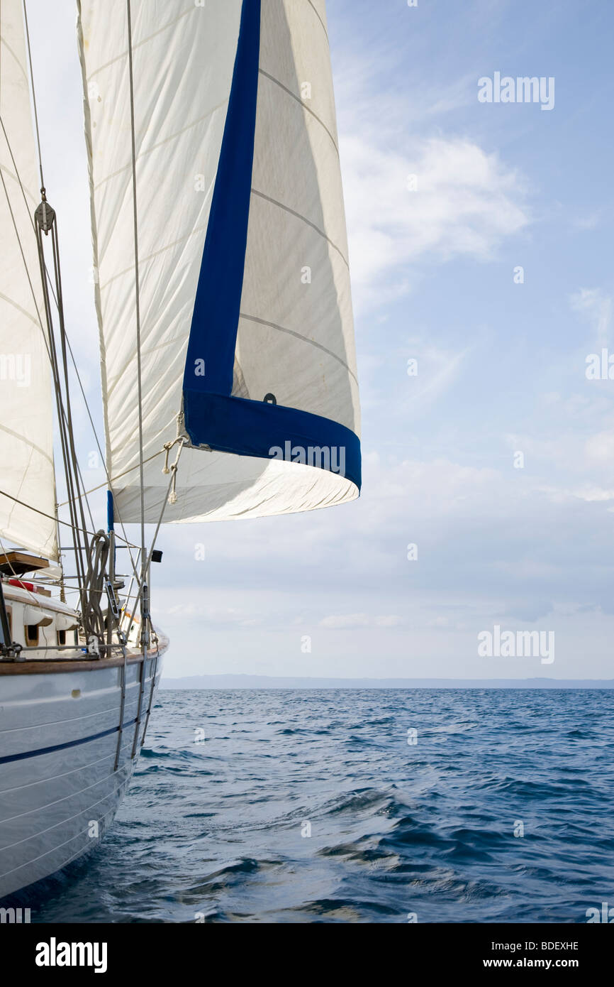 Clear blue sky and sailboat, sailing in the Golf of Papagayo, Guanacaste, Costa Rica. Stock Photo