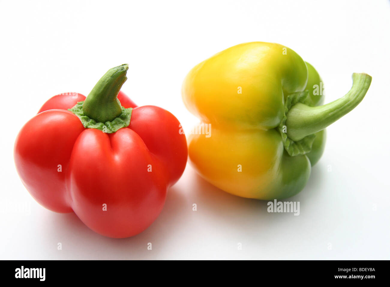 Red and yellow Bell Peppers on white background Stock Photo - Alamy
