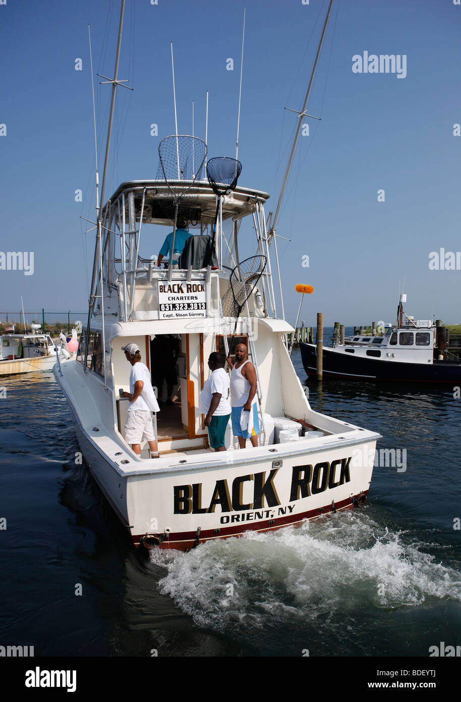 Charter fishing boat leaves Orient Point, New York Stock Photo