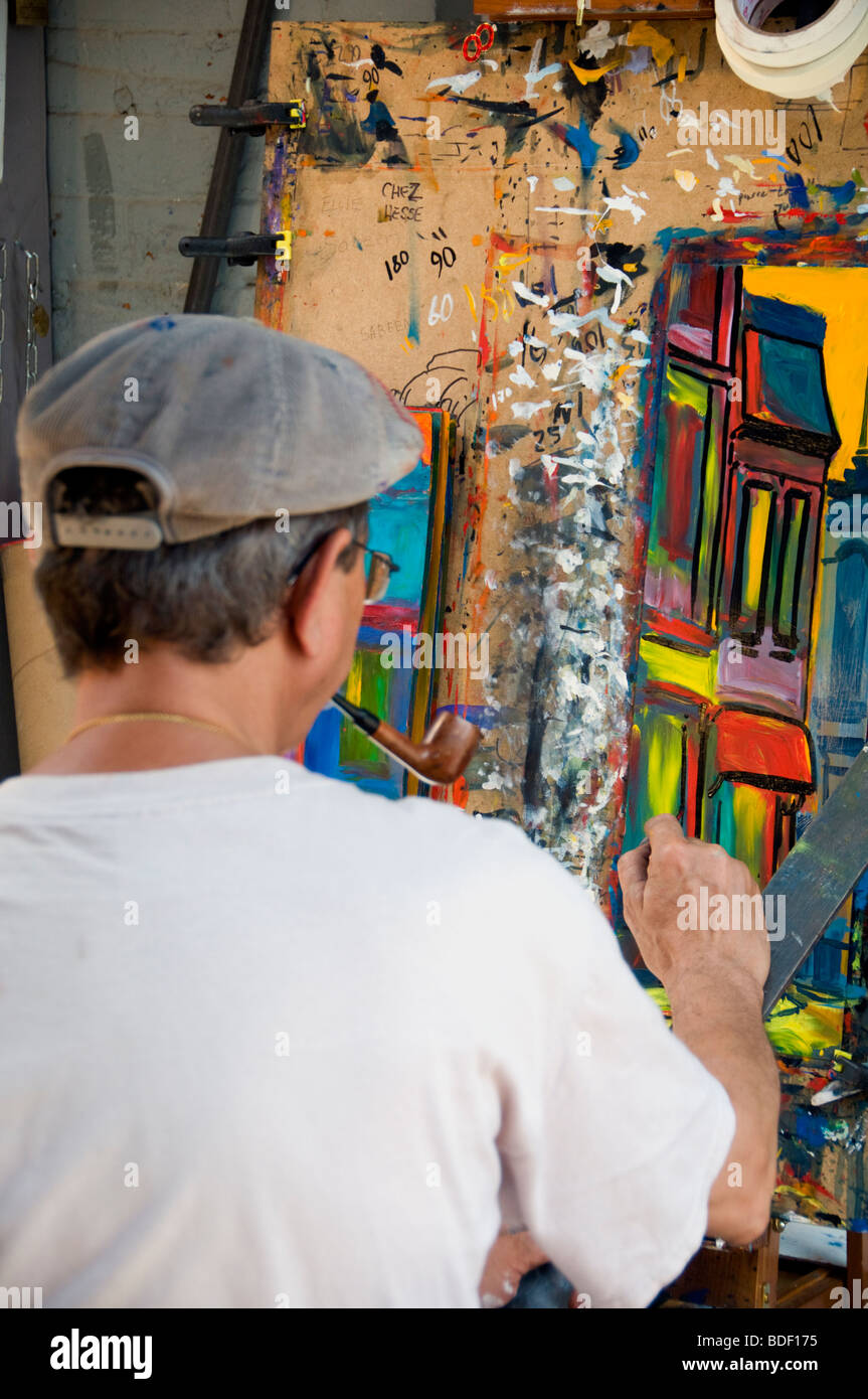An artist at work in the old quarter of downtown Montreal in Quebec