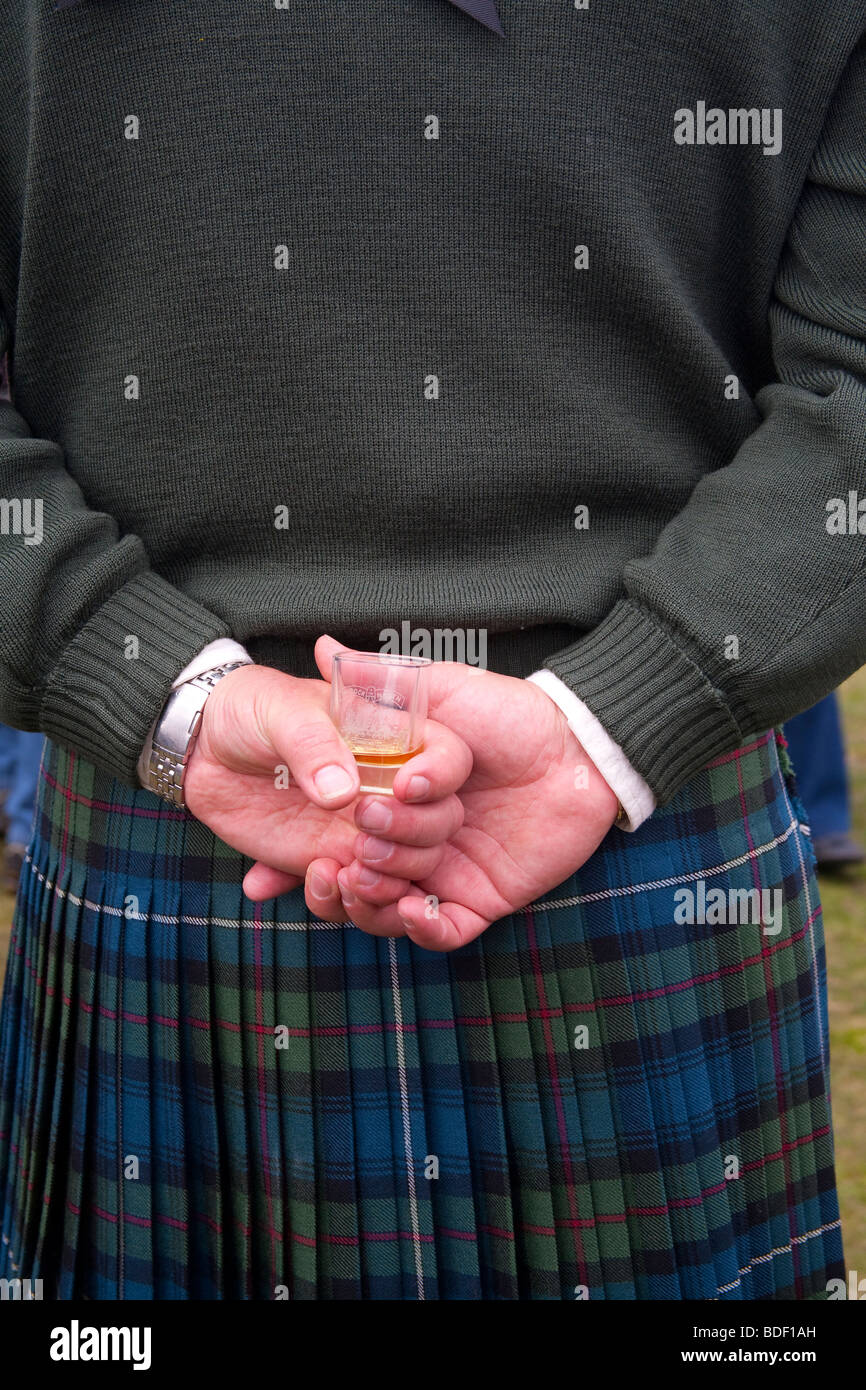 Scotsman wearing kilt  or plaid at the Lonach Scottish Highland Games & Gathering, Donside, Scotland, UK Stock Photo