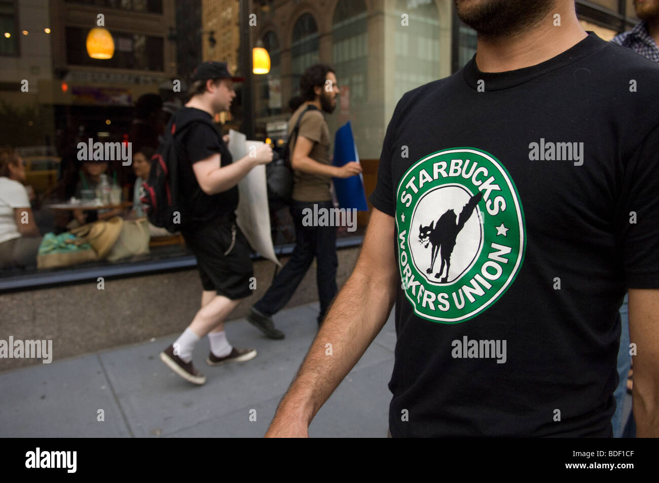 Starbucks workers and supporters protest against Starbucks' raising the