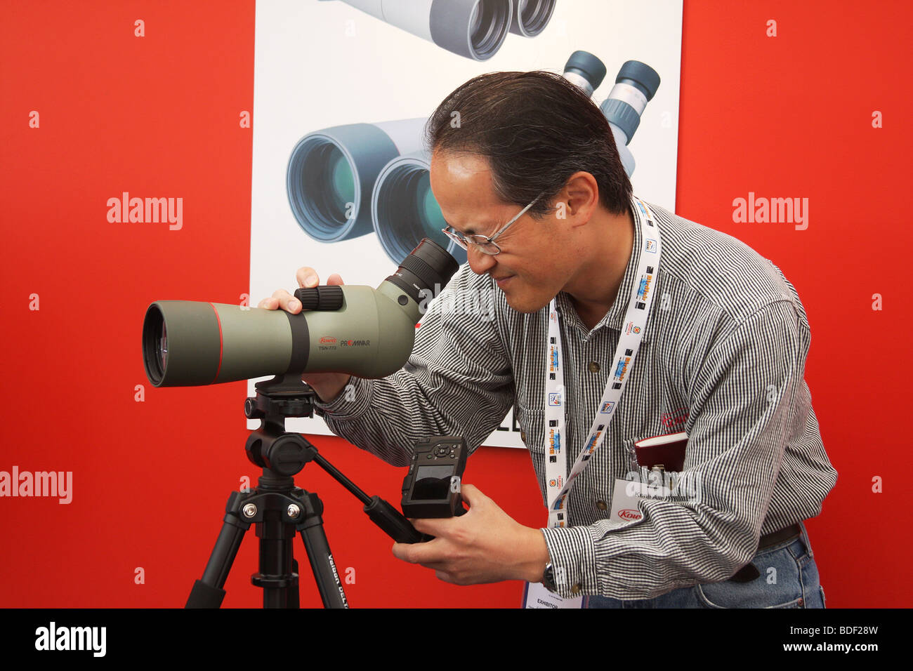 Oriental man with bird spotting scope. Stock Photo