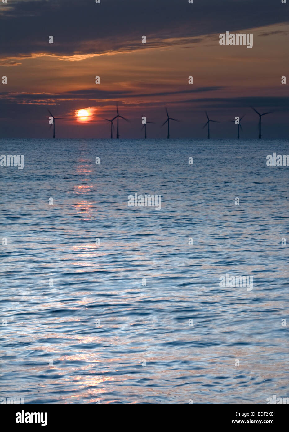 Off shore windfarm at sunrise on Norfolk Coast at Caister on Sea Stock Photo