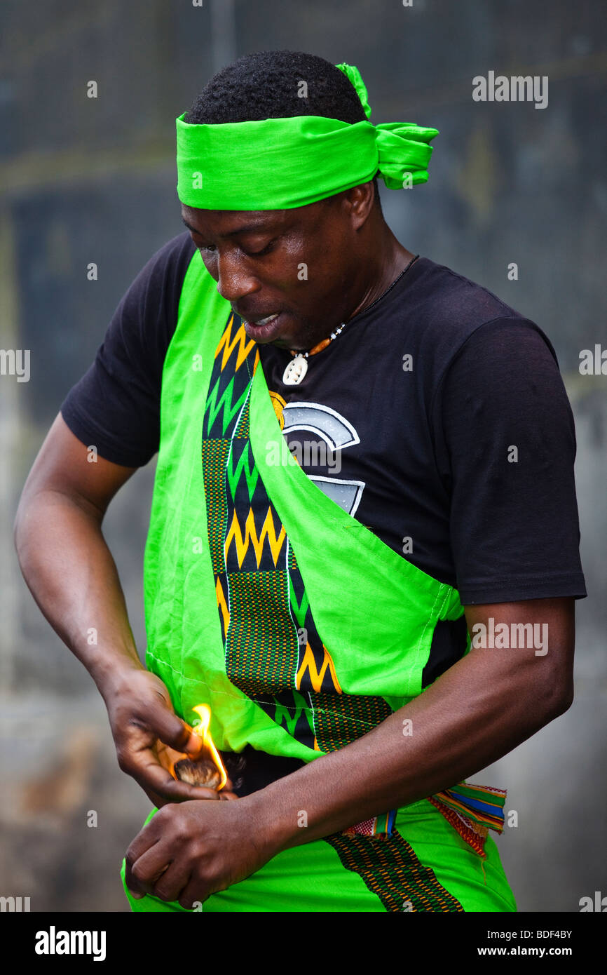Eddie Yankah street performing at Edinburgh Fringe Festival, with fire and putting it down the front of his trousers, Scotland Stock Photo