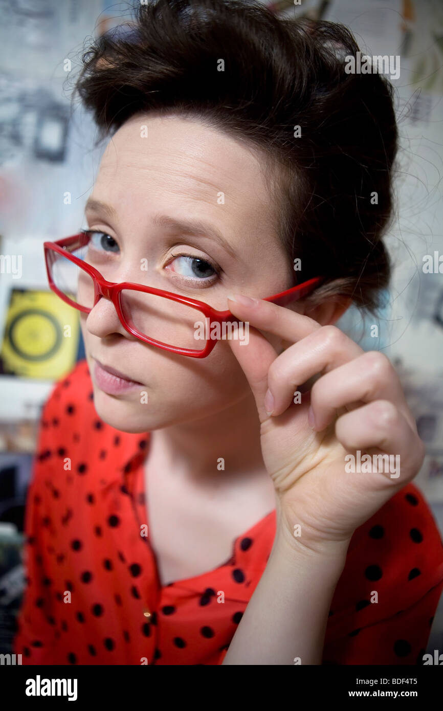 comic portrait of funny girl wearing vintage dress and comic glasses Stock Photo
