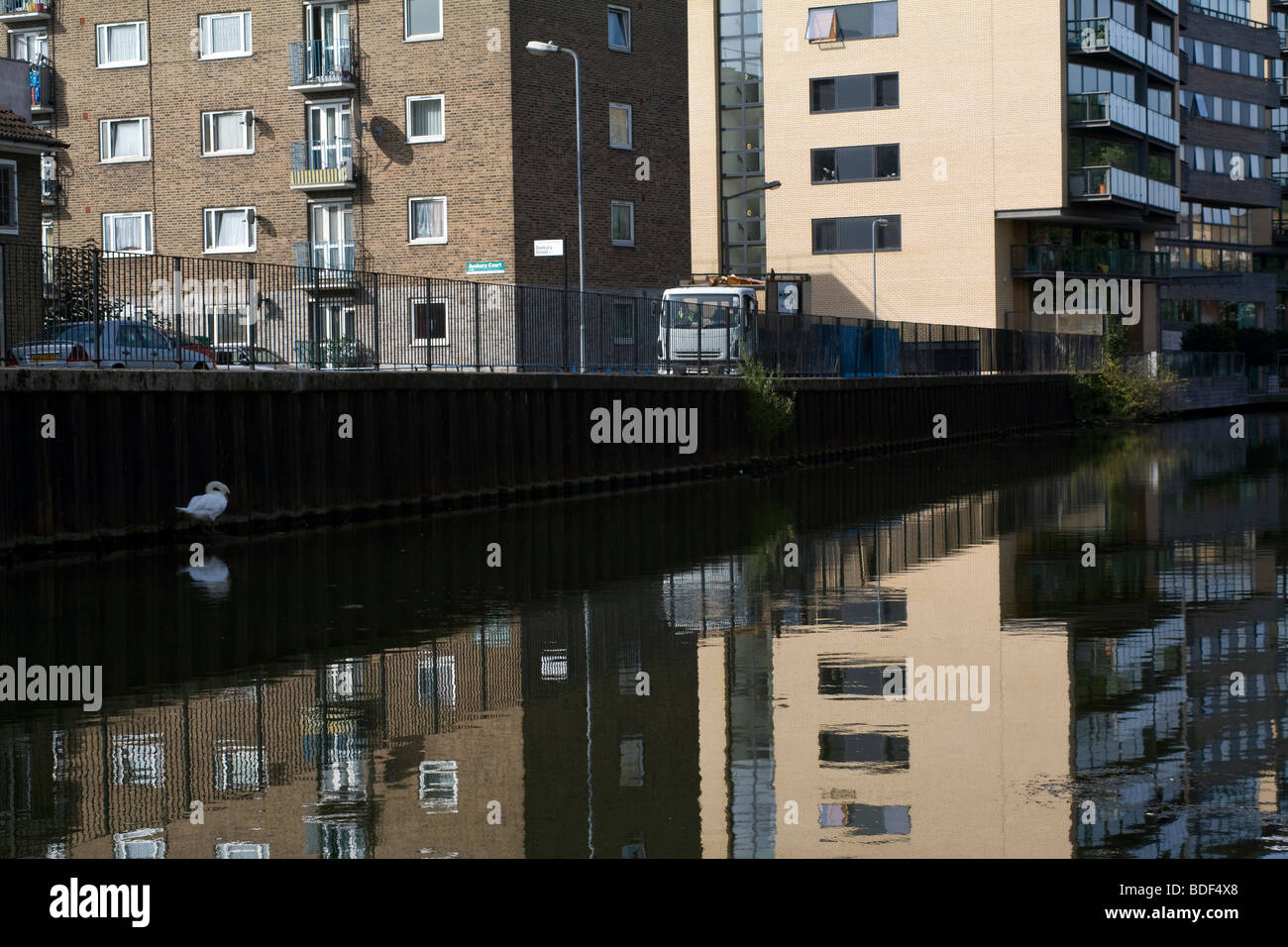 Housing Estate, a lorry, a swan, Regents Canal, London. UK Stock Photo