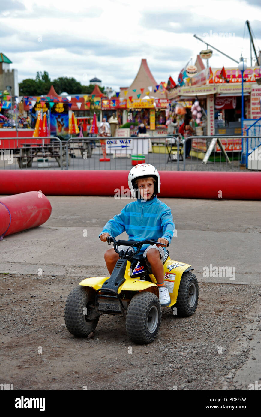 a small boy on a quad bike ride at southport funfair, england, uk Stock Photo